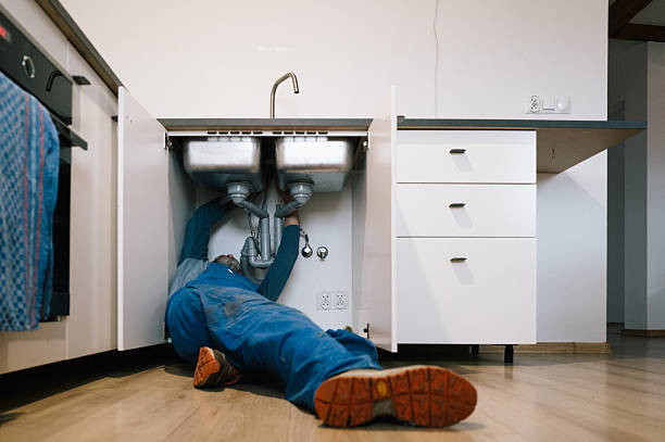 Professional Emergency Plumber technician working in Levittown, NY